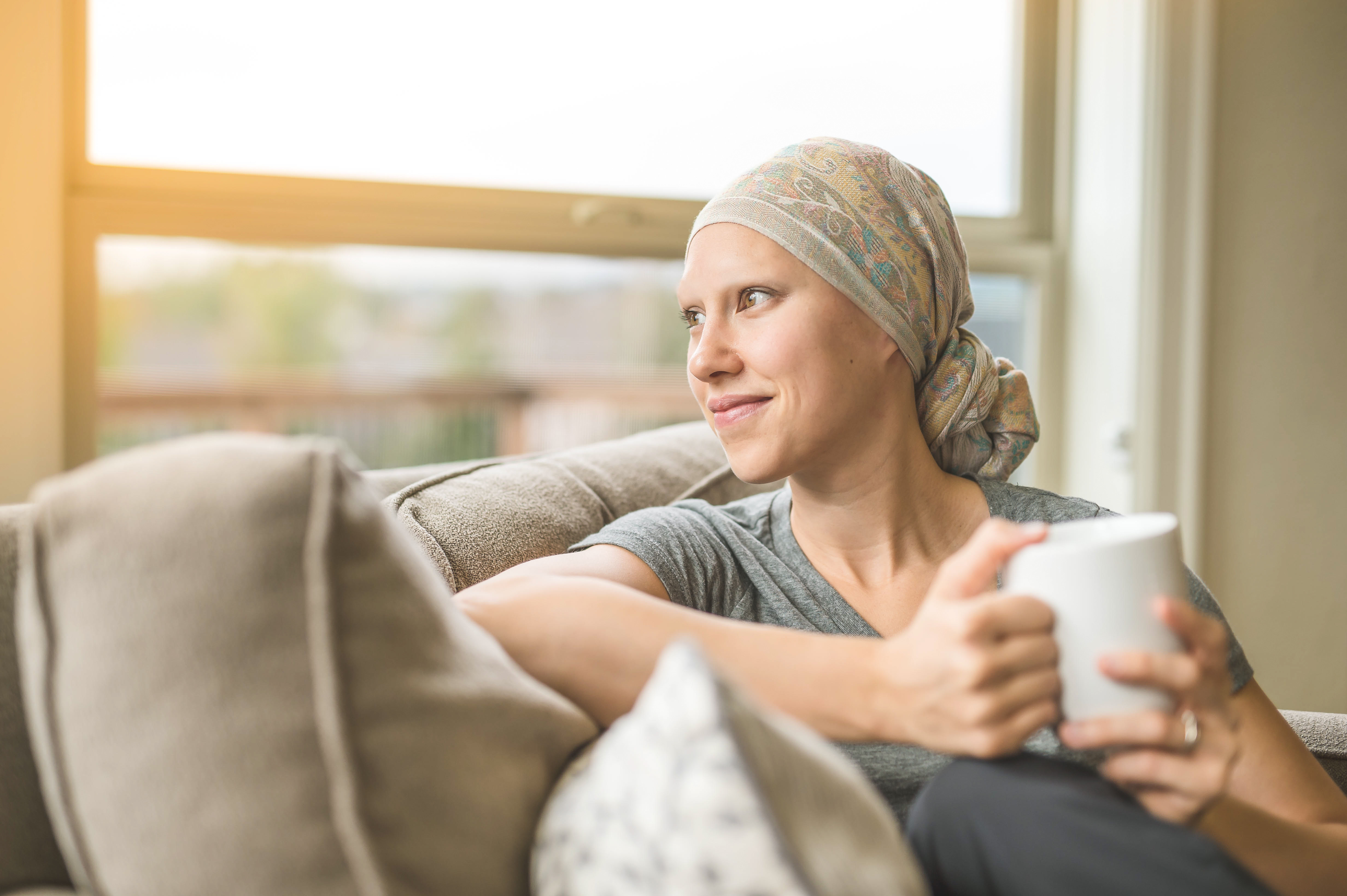 Adult female breast cancer patient sipping tea